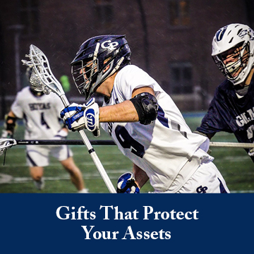 Students playing lacrosse. Links to Gifts That Protect Your Assets