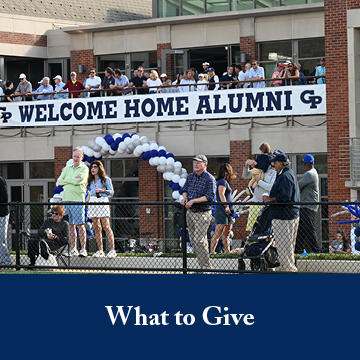 People welcoming the alumni. Links to What to Give